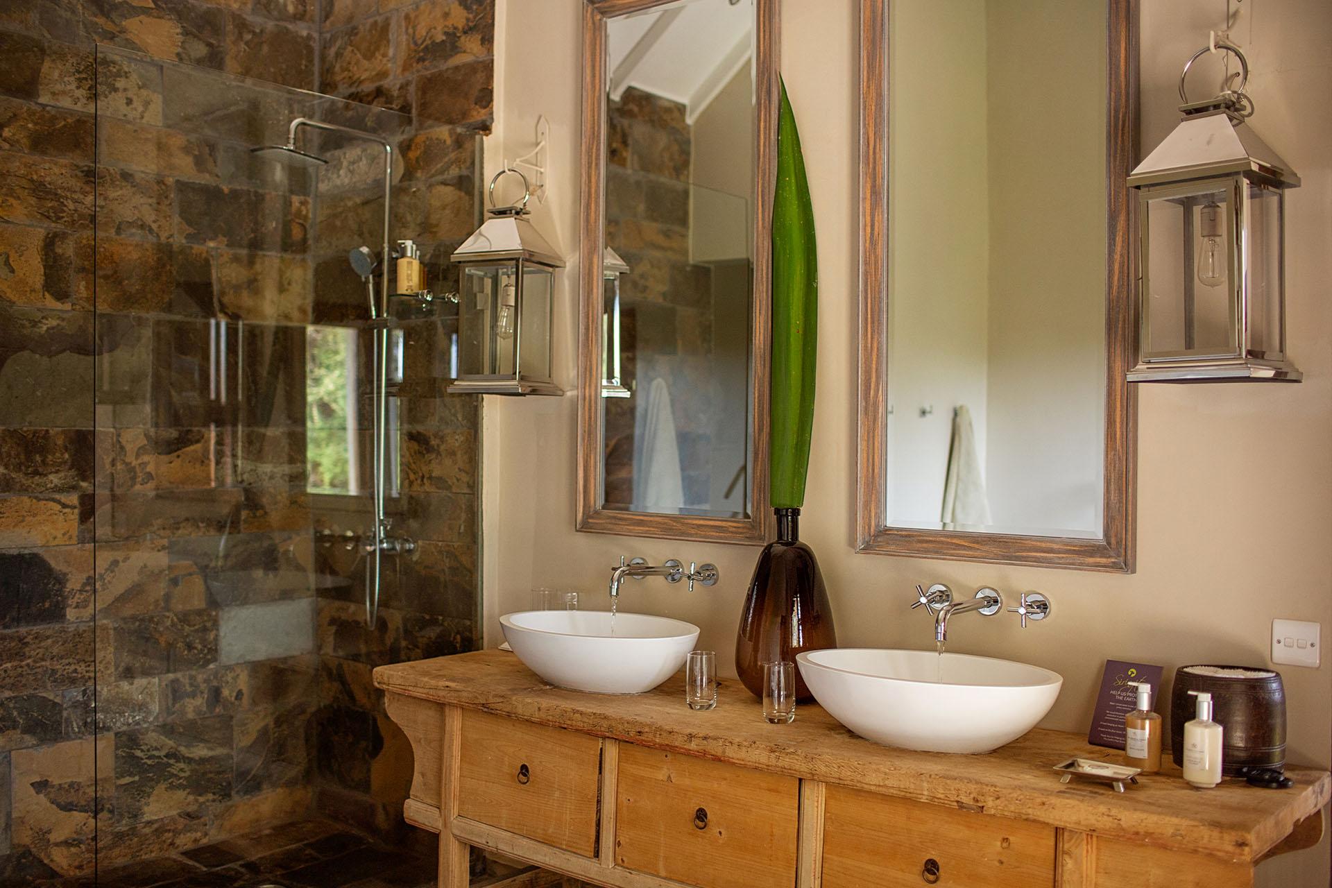 The en-suite bathrooms are spacious, with a bathtub to fill with bubbles lit by candlelight, and steaming hot showers heated by solar heaters. His and her sinks designed for ultimate ease and comfort.